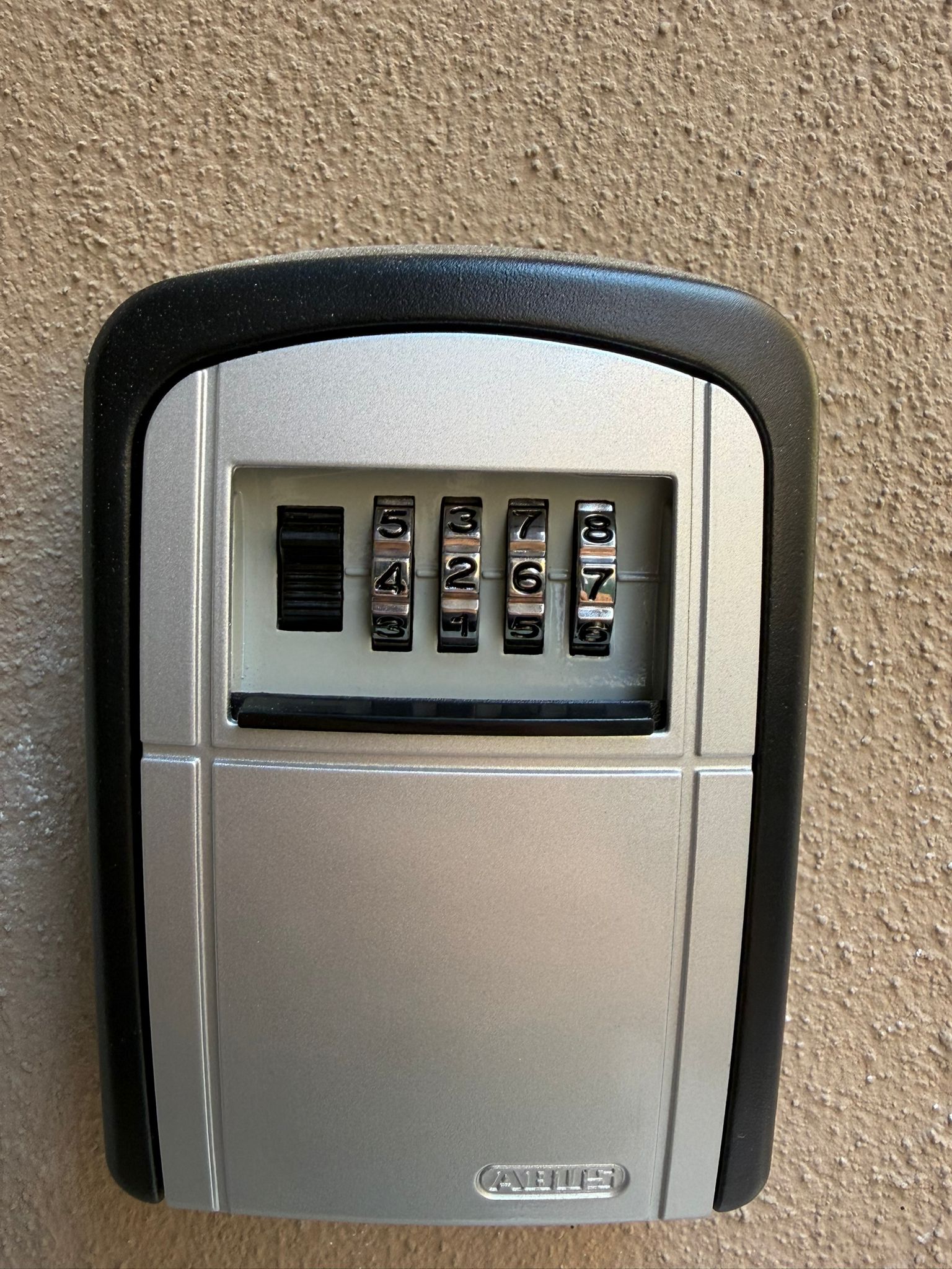 Key box on the side of the door